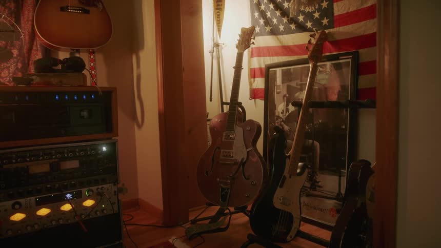 Guitars and musical equipment are in the room
