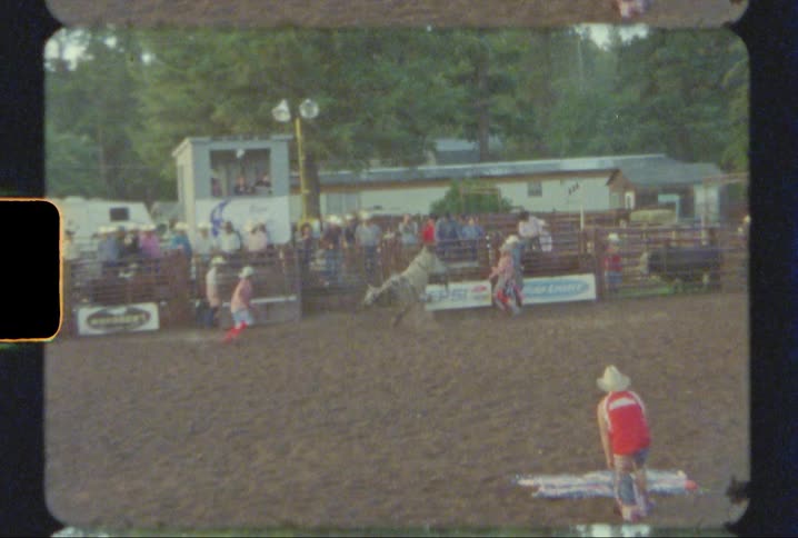 Rodeo clowns chase a bull