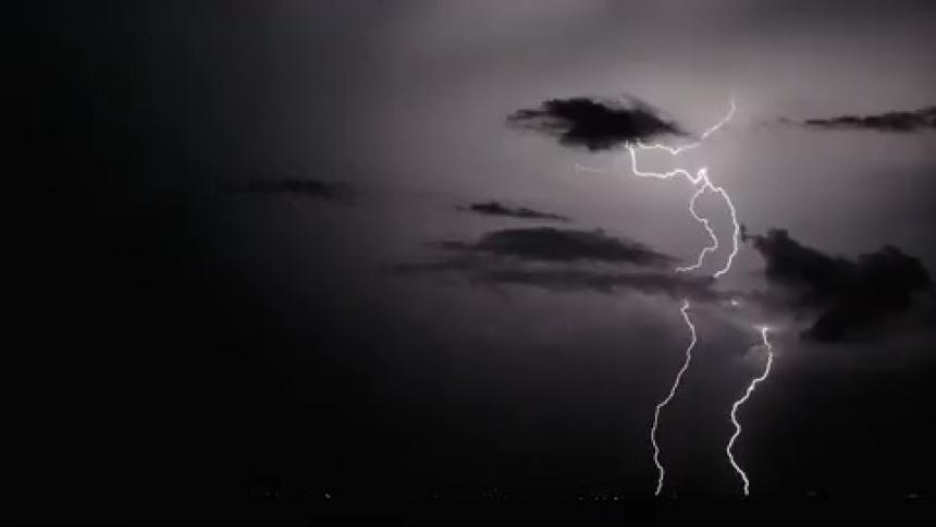 Lightning streaks through the night sky during a storm