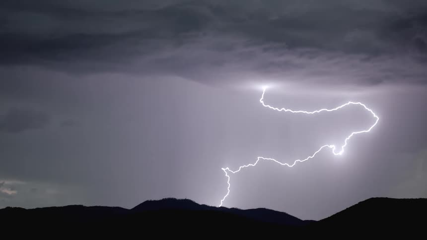 Lightning draws in stormy night sky
