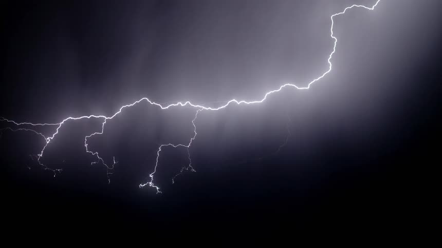 A lightning strike lights up the night sky