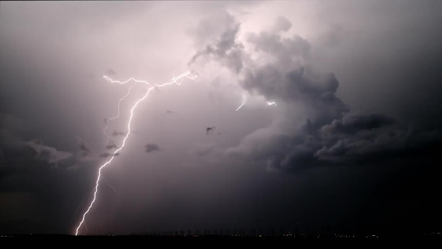 Bolts of lightning illuminate the night sky during a storm