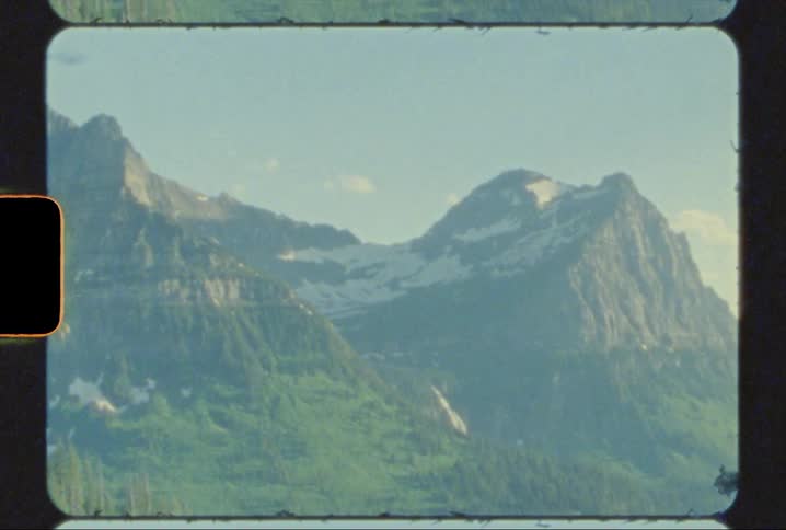 Towering peaks in glacier national park shot on 8mm film