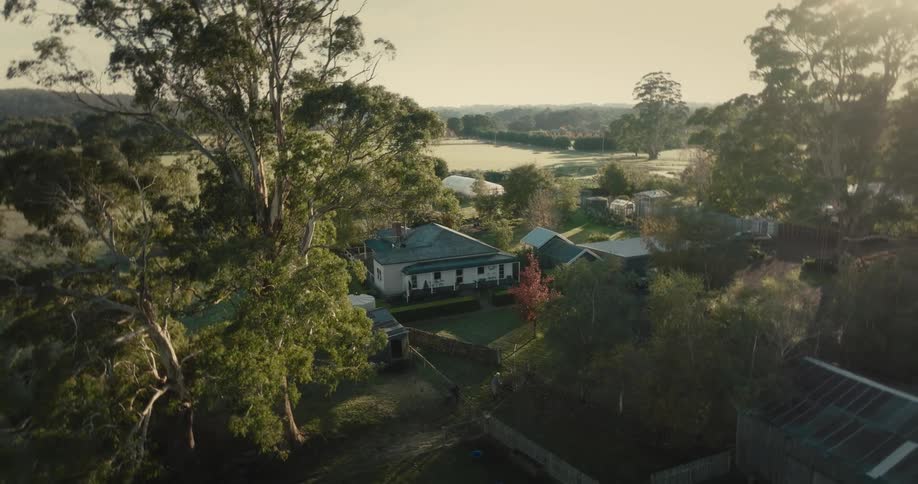 Aerial view of country houses in the countryside at sunset