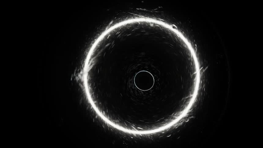 A white rippling circle rotates and emits spheres in the darkness with a moving orb inside
