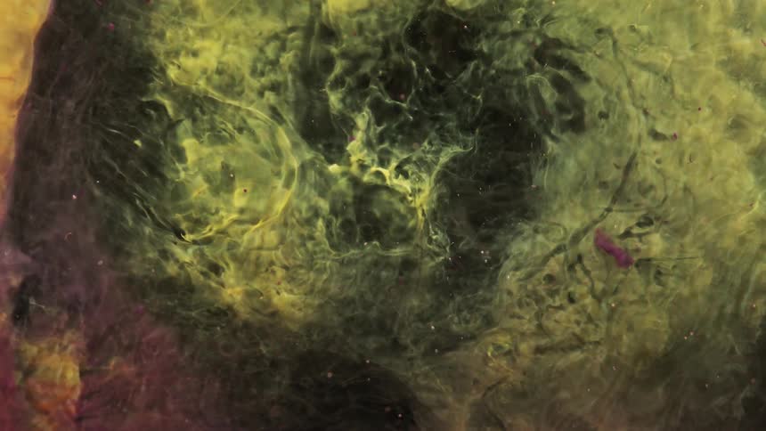 Swirling green yellow and orange liquid