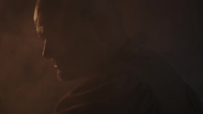 A man looks ahead in a dark area