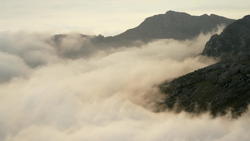 Mountain ridge and slopes with heavy cloud cover