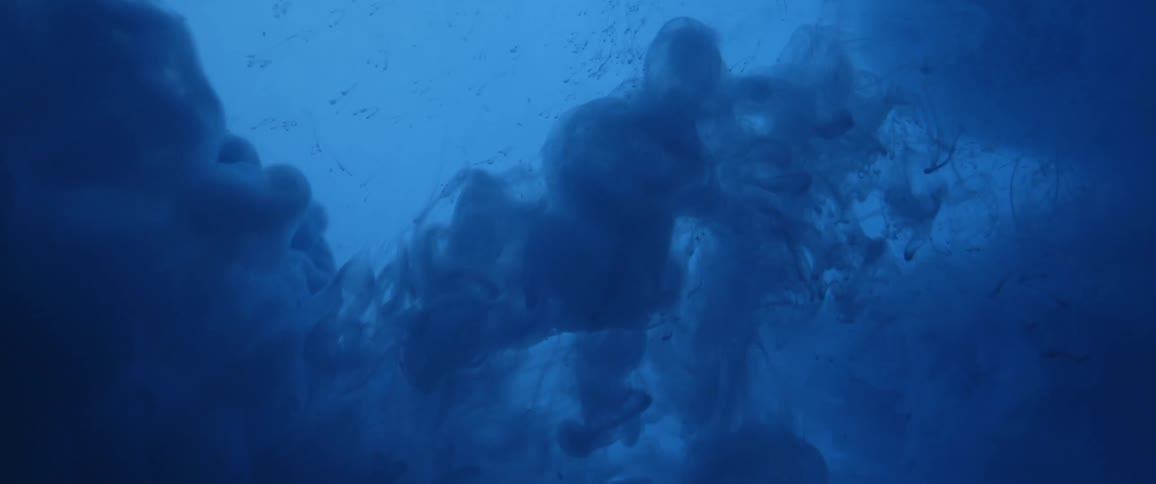 Large clouds of dye moving under water