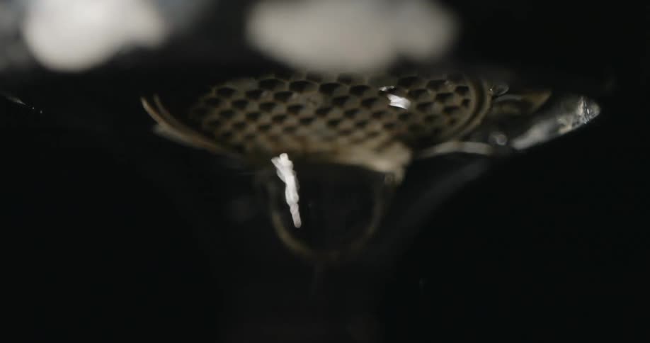 Close up of flowing water from tap pipe