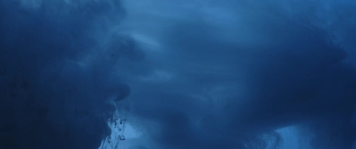 Clouds of intense dark liquid ink flowing and swirling down