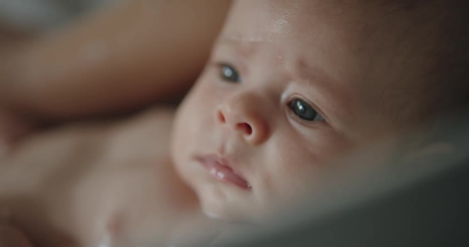 A baby is being bathed