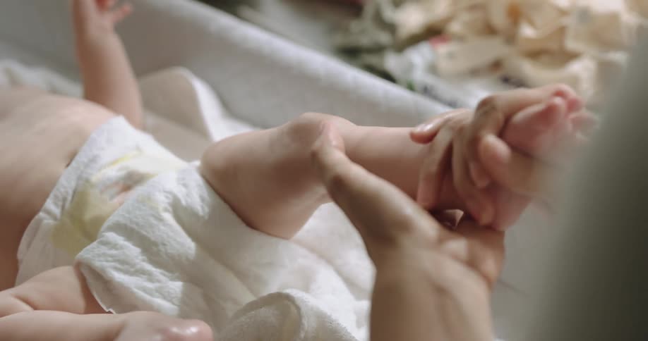 A baby is being massaged
