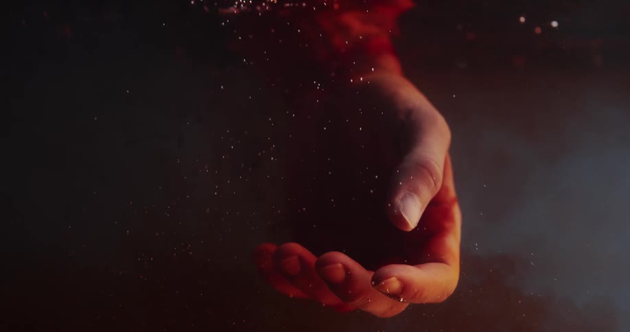 Bleeding hand falls into water and blood spreads through the liquid