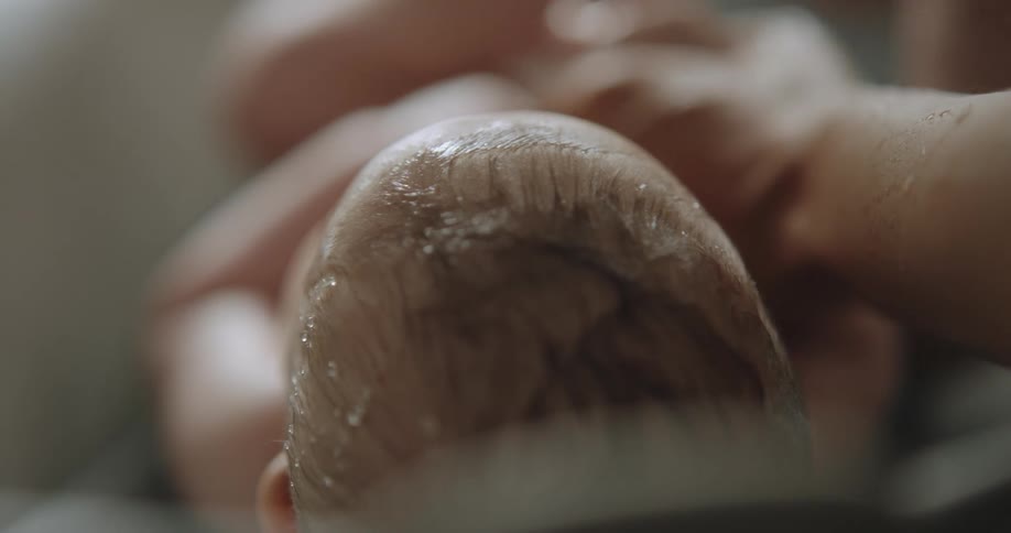 A view of a baby getting a bath