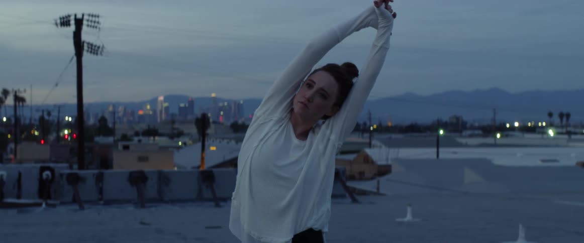 Dancers On Rooftop Overlooking City
