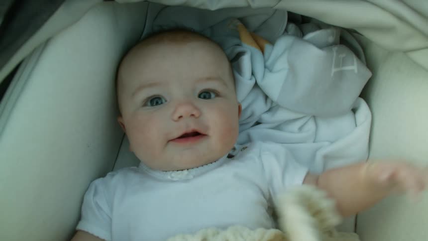 The baby is moving in the crib