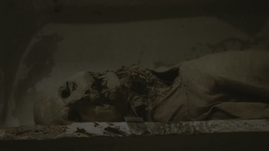 Skeletal remains lying in the catacombs