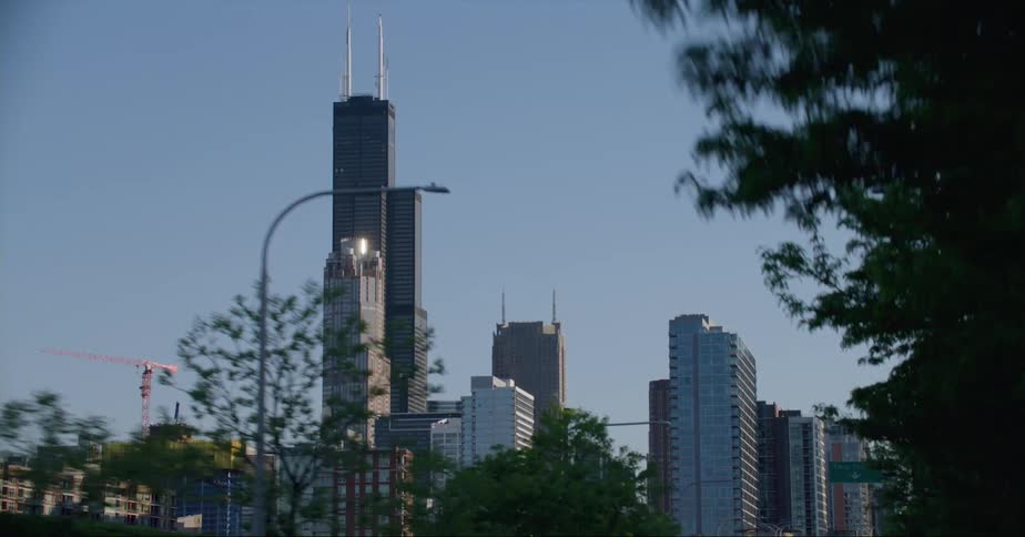 Moving into downtown tall buildings and skyscrapers stand tall on the city skyline