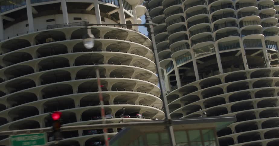 Traffic drives past the buildings