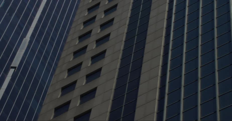 Skyscrapers towering overhead in a city in the daytime