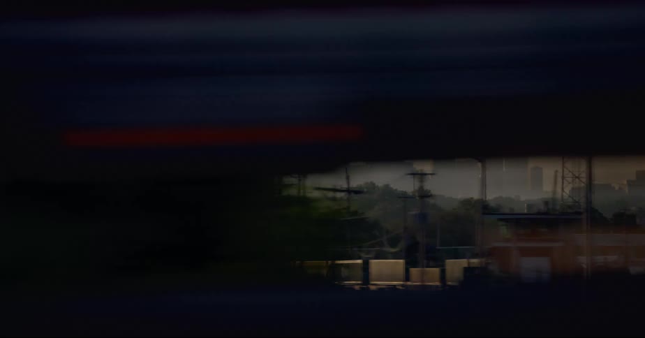 Skyscrapers on the foggy chicago skyline seen from a moving vehicle at evening