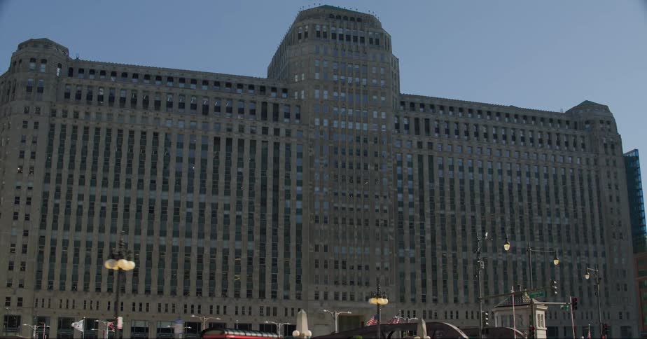 Traffic moves by the merchandise mart building in downtown chicago