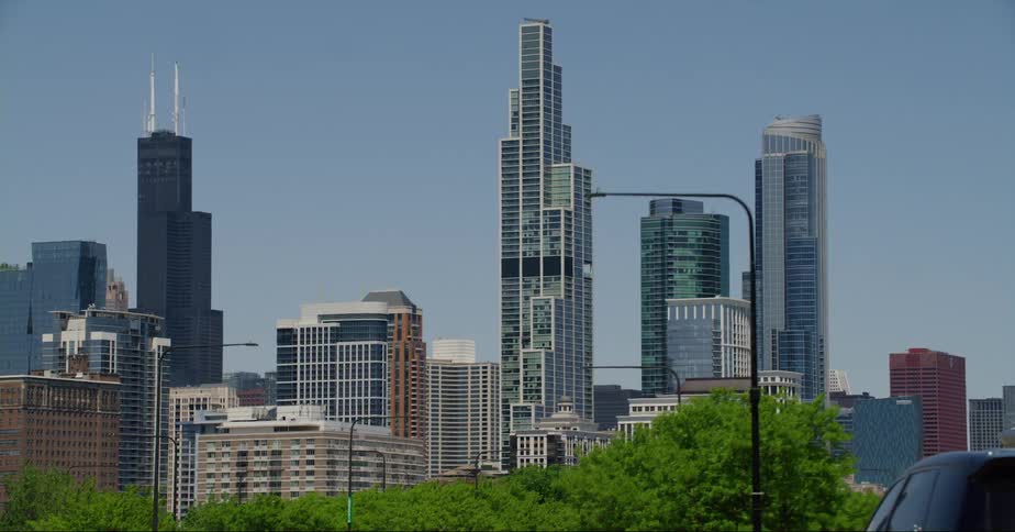 A tree lined street heads toward downtown