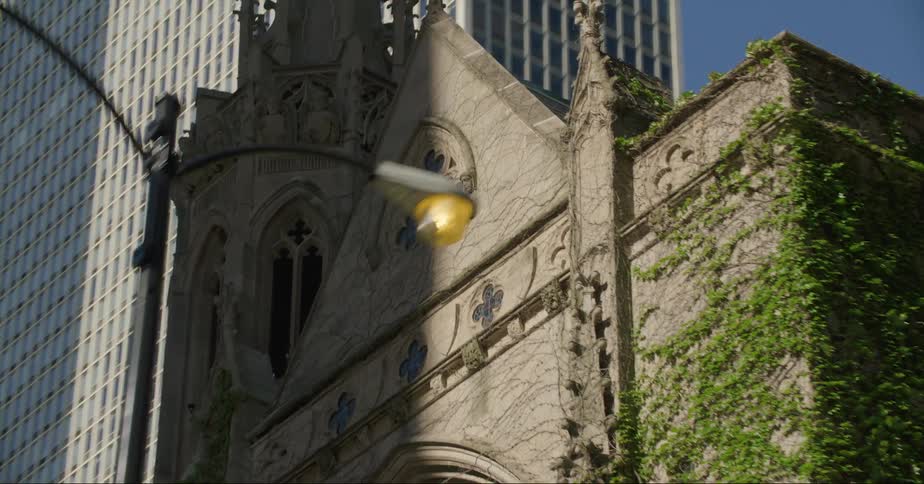 Ivy grows up the side of a downtown church