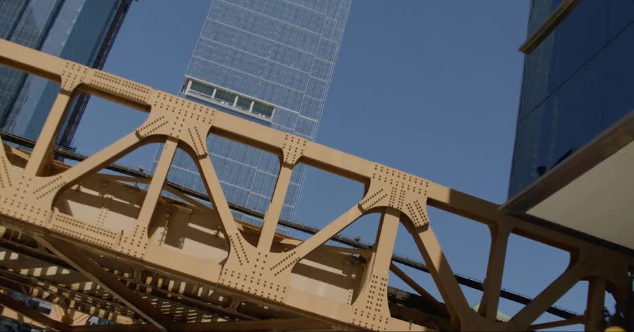 An overpass between office buildings in a city