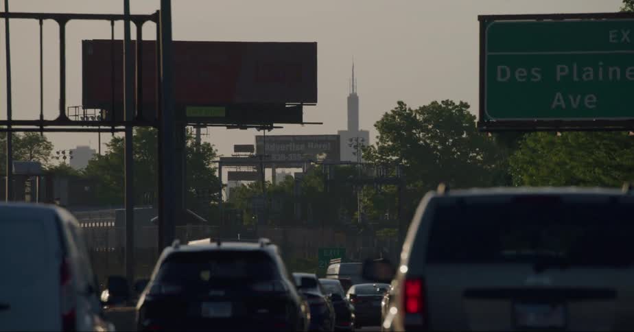 Cars commuting in heavy traffic on an urban street
