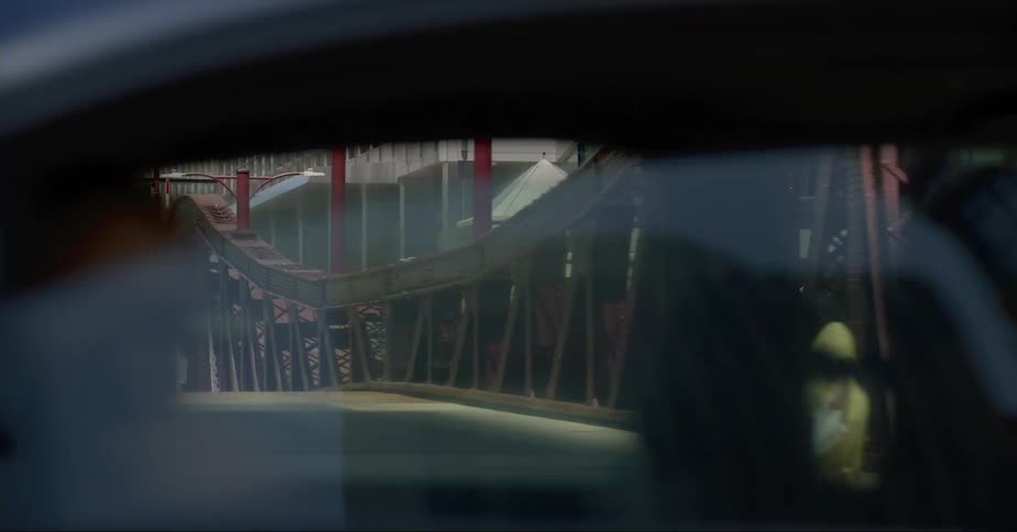Cars driving and people walking in a city