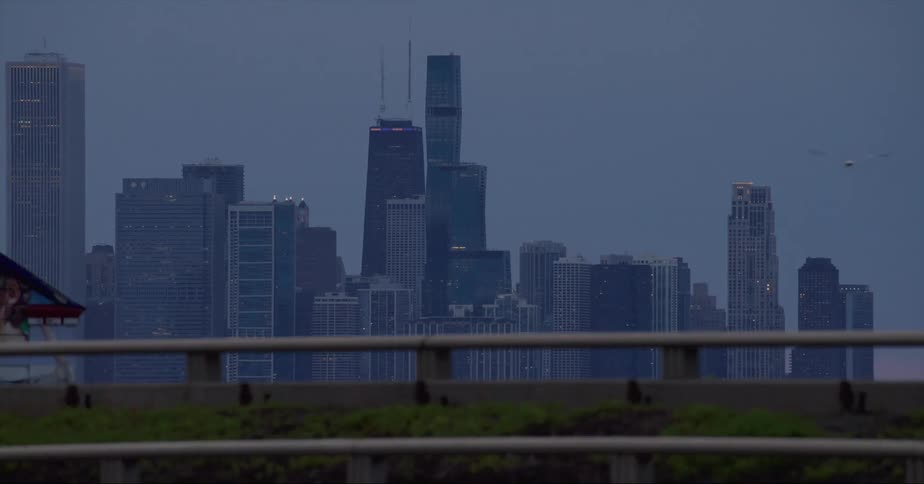 Vehicles travel on the freeway by the city