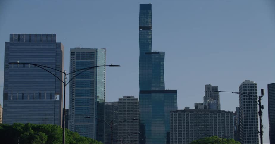 Moving into downtown tall buildings and skyscrapers stand tall on the city skyline