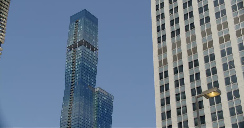 Skyscrapers and office buildings against the blue sky at dusk in the city