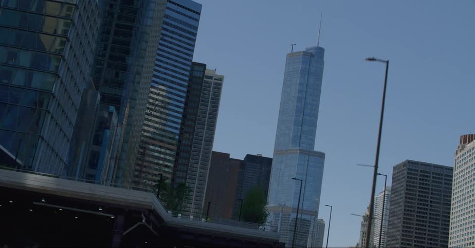 Twisting footage of the trump tower skyscraper on the chicago skyline at daytime