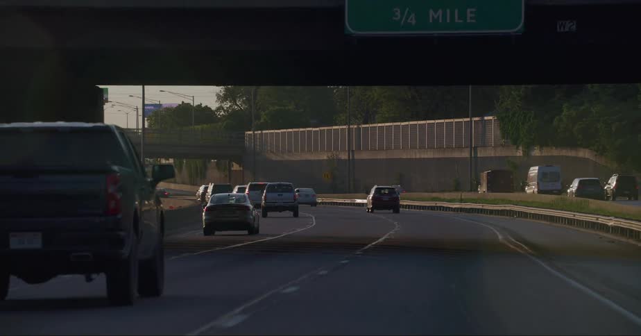 Cars driving on the light traffic on the freeway at evening or morning