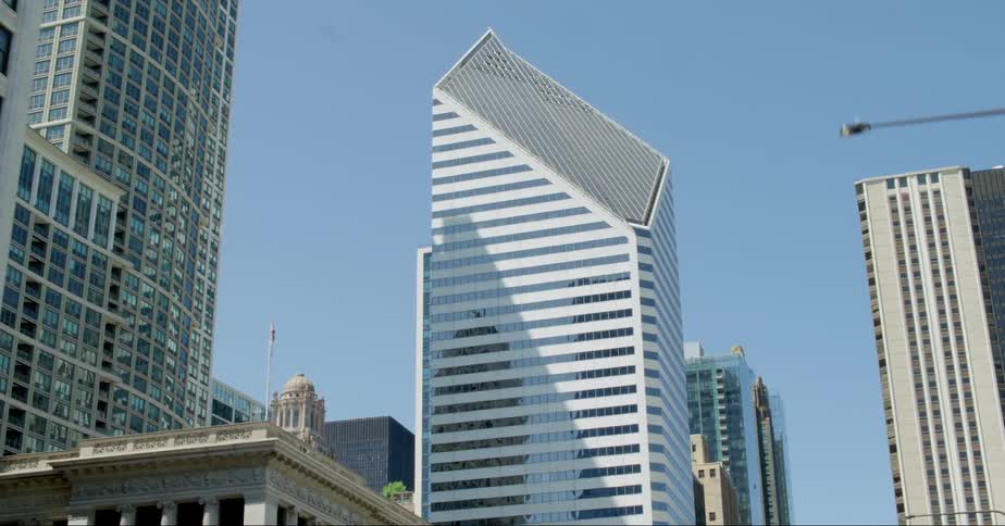 Tall steel and glass skyscrapers fill a city skyline
