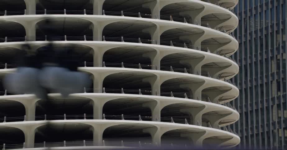 Marina city building in chicago filmed from a moving car on the street