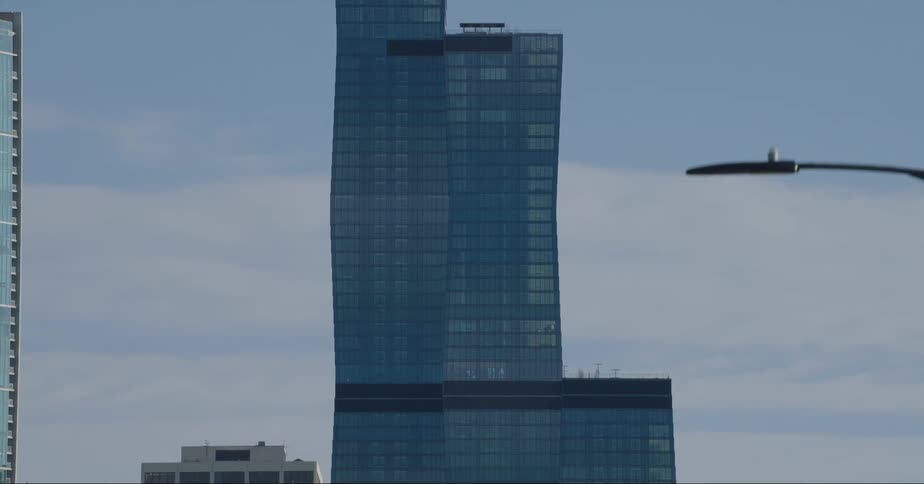 St regis building in the chicago skyline filmed from a car driving on the street
