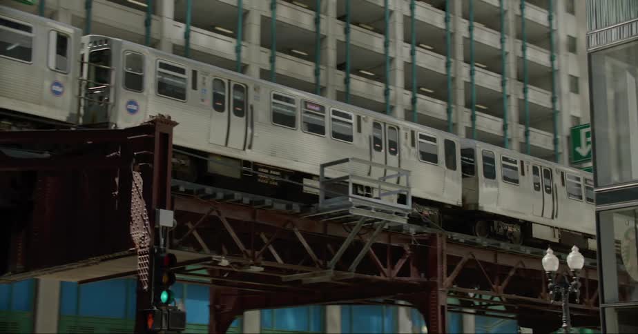Trains and cars travel through the city