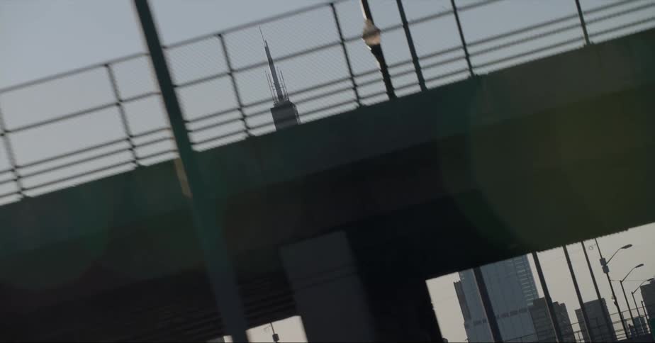 Twisting footage of skyscrapers on the chicago skyline seen from a moving car