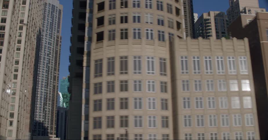 Downtown skyscrapers reflect bright sunshine