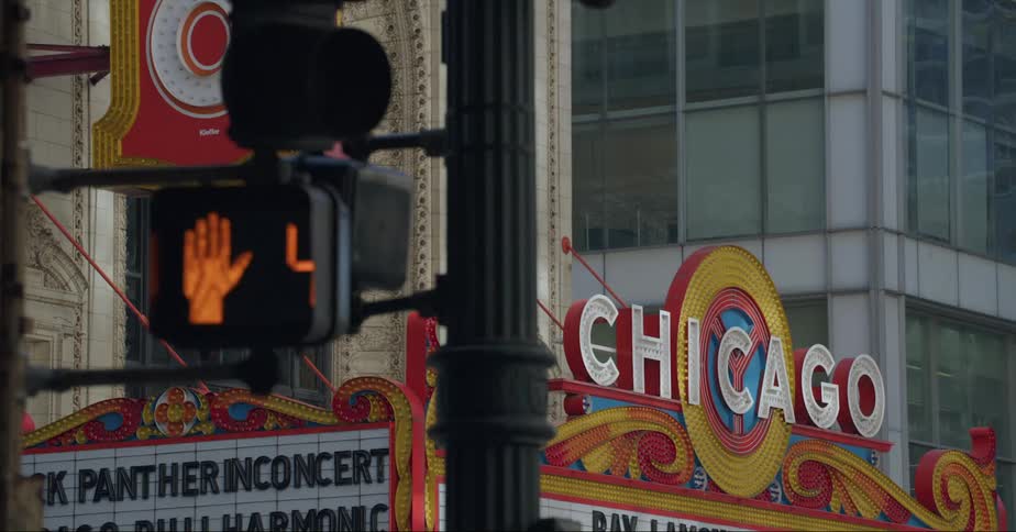 Billboards and traffic lights on the street of a city