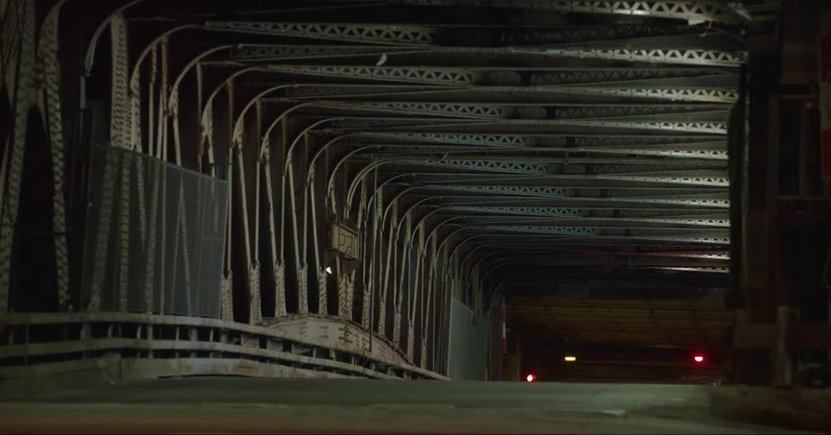 Vehicles drive through dark tunnels