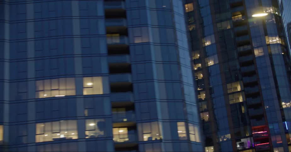 Aerial view of illuminated modern condos in the city