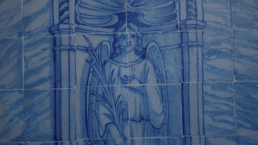 The wall has an angel painted on it