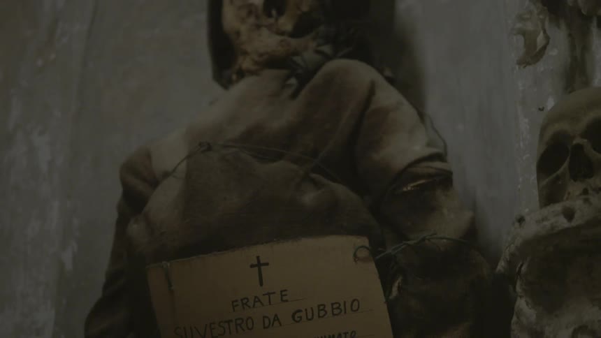 A corpse has a sign tied to it