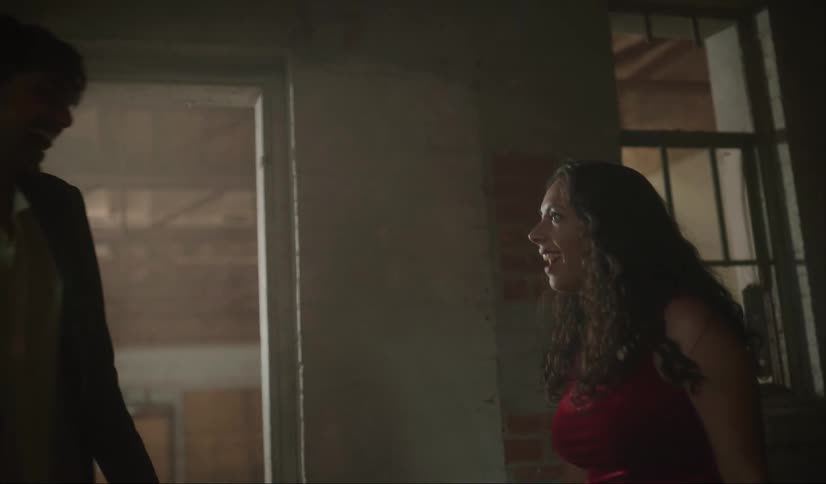 A man escorts his date into a darkened room to dance and she reacts with surprise