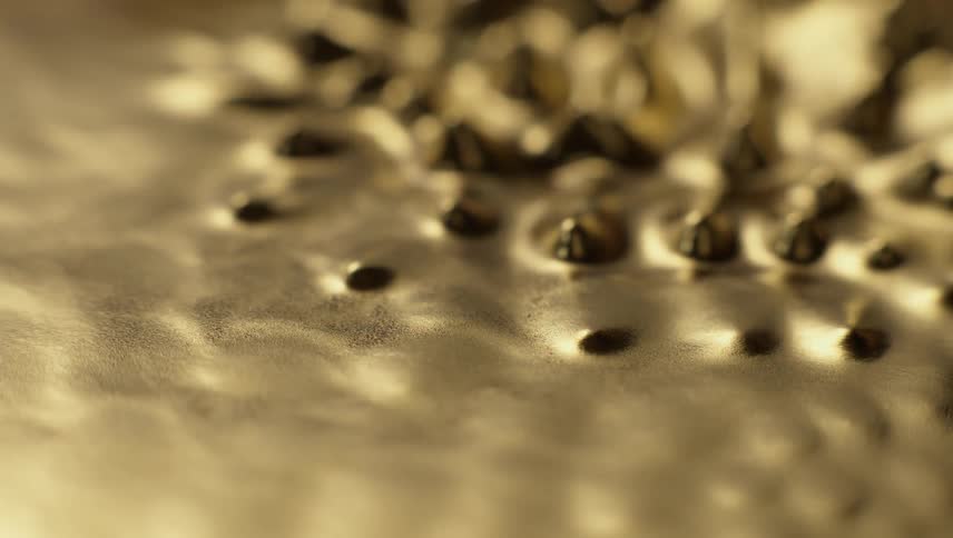 Golden peaks and ridges form from vibration then subside